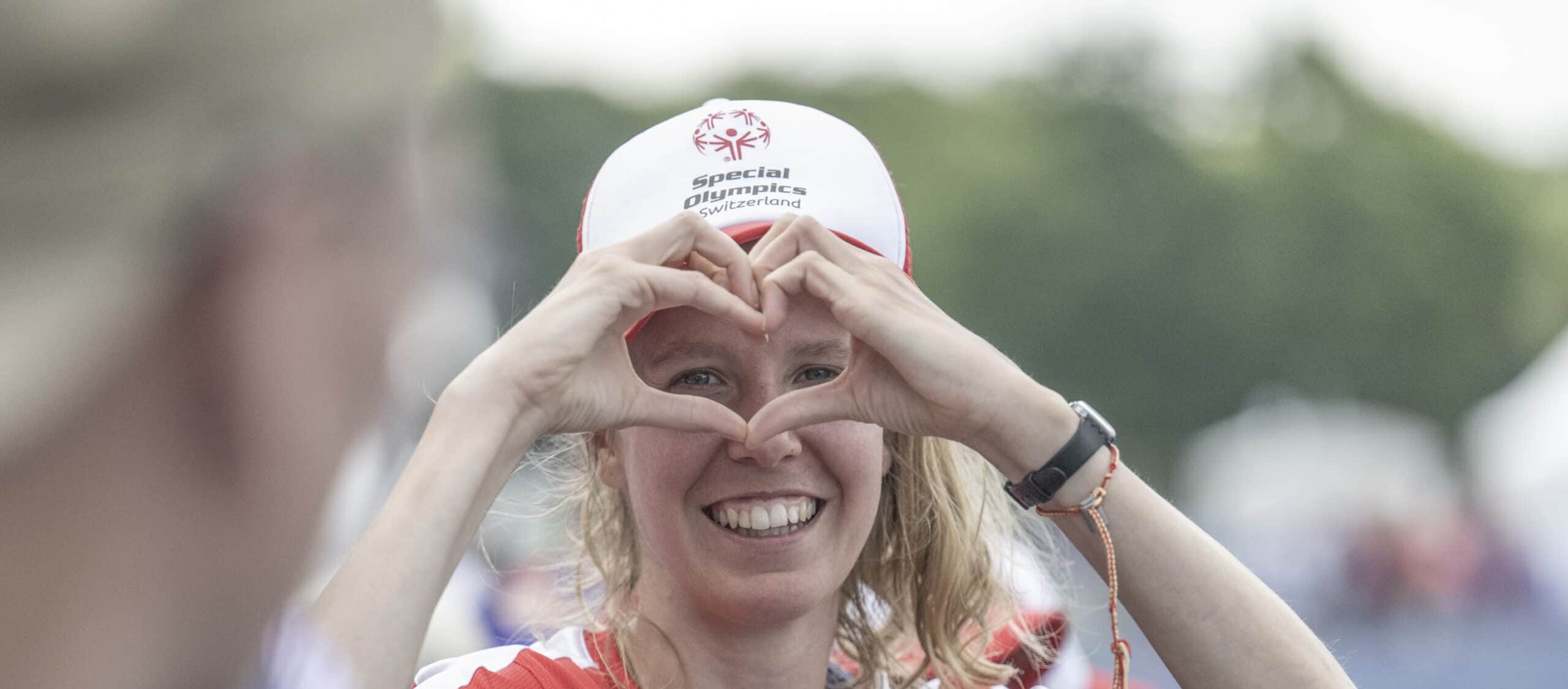 A volunteer smiling warmly